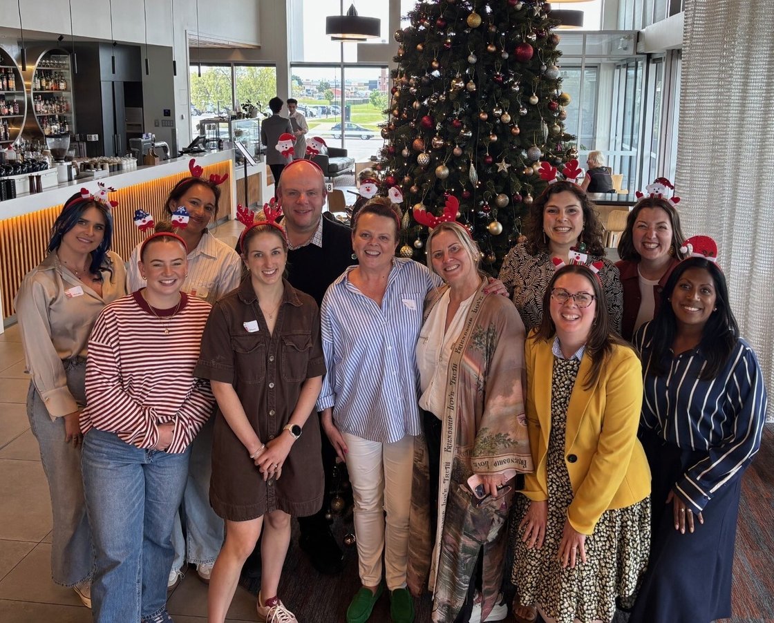 Launceston Central staff and board group photo in front of tree